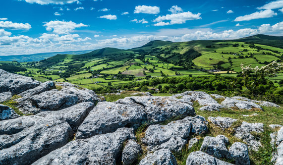 Beautiful view of rolling green hills with blue skies