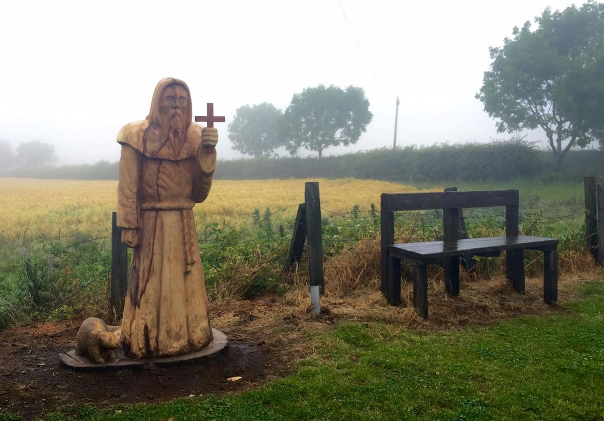 A carved wooden figure depicting St Cuthbert